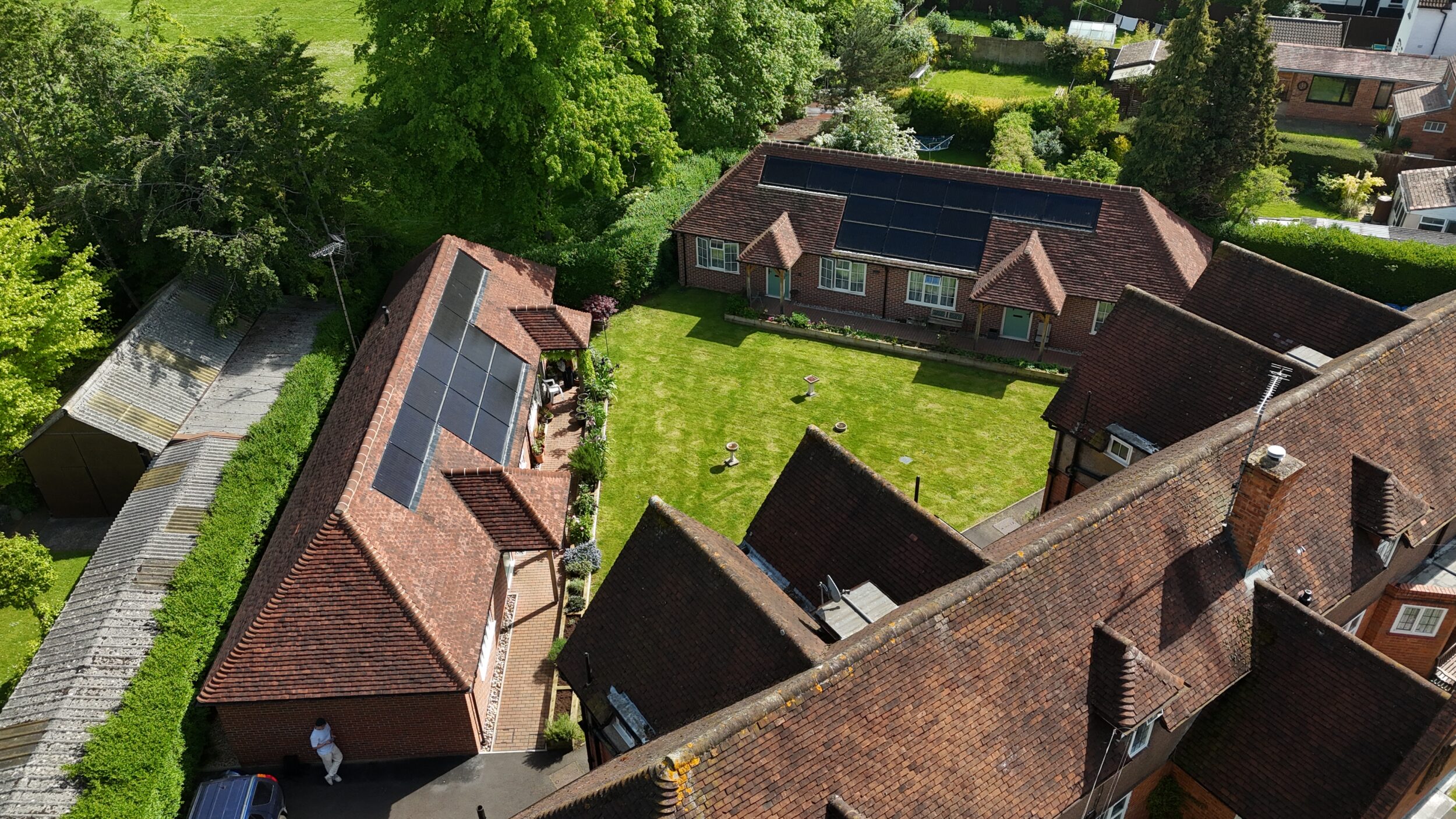 Drone shot of community cottages with solar panels